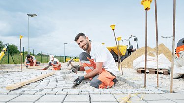 STRABAG paving a way Photo of a construction worker paving a path